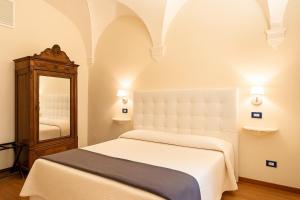 Postel nebo postele na pokoji v ubytování B&B Quattro Cantoni