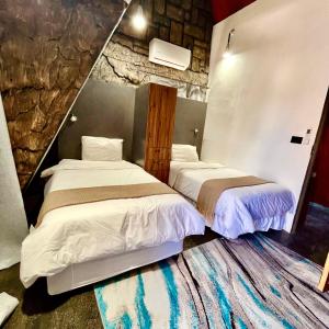 Postel nebo postele na pokoji v ubytování Rustiek Hotel