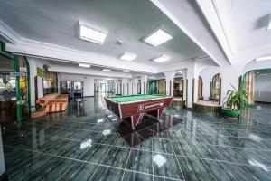 a large room with a pool table in it at Hotel Zdravets in Varna City