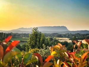 a view of a field with mountains in the background at Le Moulin in Aix-en-Provence +8 photos