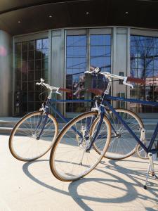 two bikes parked in front of a building at North Bund 681 in Shanghai