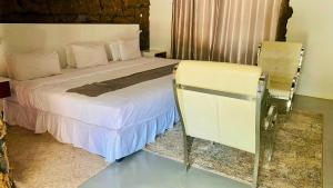 Postel nebo postele na pokoji v ubytování Rustiek Hotel