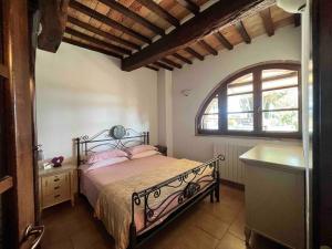 En eller flere senge i et værelse på PoloTuristicoUmbria Residence al Lago con Piscina