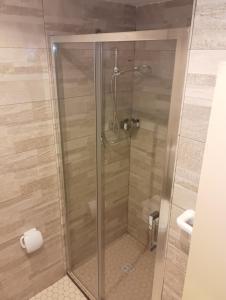 a shower with a glass door in a bathroom at Hotel CARLO in Riccione +29 photos