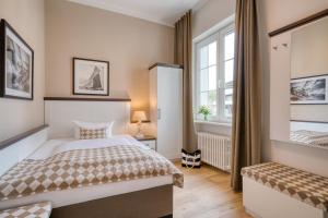Postel nebo postele na pokoji v ubytování Hotel Strandschlösschen