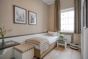 Postel nebo postele na pokoji v ubytování Hotel Strandschlösschen