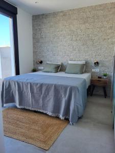 En eller flere senge i et værelse på CasaMano