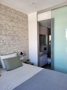 En eller flere senge i et værelse på CasaMano + 15 billeder