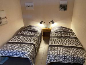 Postel nebo postele na pokoji v ubytování Val-locations sancy2