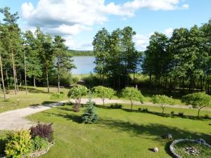 an aerial view of a park with a lake at Kosewo 78 Family Hotel & Spa in Kosewo