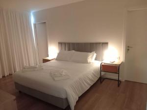 Ένα ή περισσότερα κρεβάτια σε δωμάτιο στο Apartamento Sonho Sky