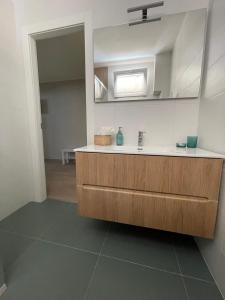a bathroom with a sink and a mirror at Le Casette by Freshome in Turin
