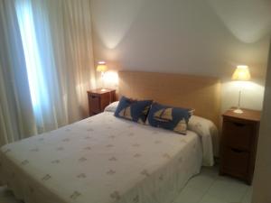 Ένα ή περισσότερα κρεβάτια σε δωμάτιο στο Miraflores Resort