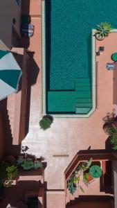 a view of a building with a door and some plants at Terra Verde Oia by K&K in Oia