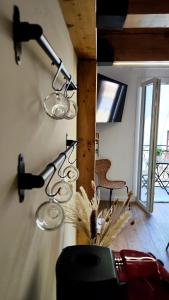 a couple of lights hanging on a wall at Disìu Apartment con Jacuzzi in centro a Castellammare del Golfo in Scopello