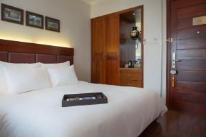 Voodi või voodid majutusasutuse Hanoi E Central Luxury Hotel & Restaurant toas