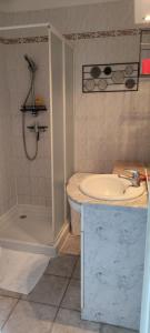 a bathroom with a sink and a shower and a tub at Casa Di l'alba in Borgo