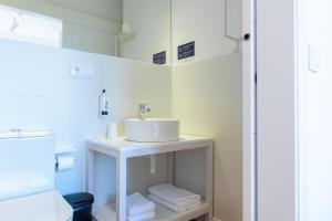 Salle de bains dans l'établissement Alda Corrubedo