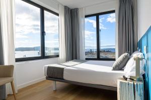 Un ou plusieurs lits dans un hébergement de l'établissement Alda Corrubedo