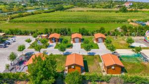 an aerial view of a house with a parking lot at Natyra e Ishullit -Resort- in Ishull-Shëngjini