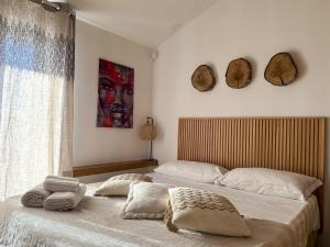 a bedroom with two beds with pillows on them at Tenuta Rurale Luxury&Nature in Gravina in Puglia