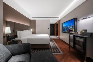 Postel nebo postele na pokoji v ubytování Intercity Shanghai Hongqiao NECC