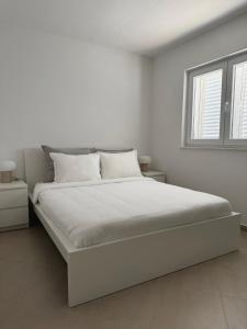 Postel nebo postele na pokoji v ubytování Isla Lux Apartment