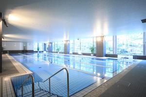 a large swimming pool in a building at Daiwa Roynet Hotel Tokyo Osaki in Tokyo