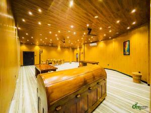 a large room with a table and benches in it at Om Ayurvedic Resort & Spa in Unawatuna