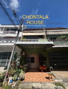 a building with a sign for a chontilla house at Choltara home in Hat Yai