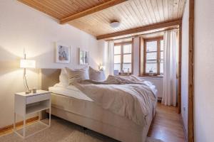 a bedroom with a large bed and a window at Muschel in Fehmarn