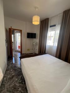 Postel nebo postele na pokoji v ubytování Apartamentos La Aldea Suites