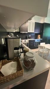a kitchen with a table with a basket of food at BUDGET Kvamseter Lodge in Eikjedalen +22 photos