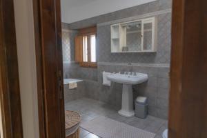 a bathroom with a sink and a toilet at La dimora di Radha B&B Centro Olistico in Rende +52 photos