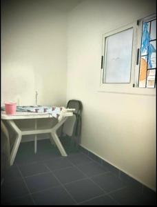a bathroom with a sink and a window at Hoceima in Al Hoceïma +20 photos