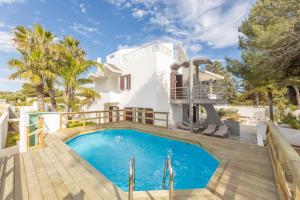 a villa with a swimming pool and a house at Villa Vela Bianca in Pizzo