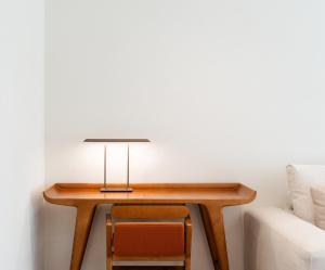 a table with a lamp and two chairs next to a couch at Villa Dubrovnik in Dubrovnik +75 photos