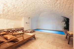a room with a swimming pool in the ceiling at Maison Gaîté in Paris