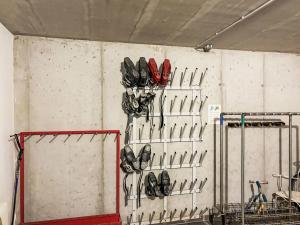 a wall filled with lots of pairs of shoes at Apartment Mentenwirt Alp Lungau by Interhome in Sankt Michael im Lungau