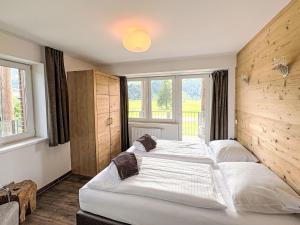 Ένα ή περισσότερα κρεβάτια σε δωμάτιο στο Apartment Oskar - Top 4 by Interhome