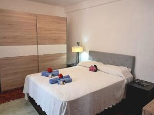 a bedroom with a bed with two teddy bears on it at Apartment Dom Carlos by Interhome in Cascais