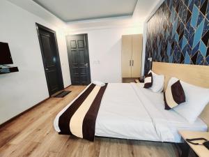 Φωτογραφία από το άλμπουμ του Tipsyy Inn Suites 003 σε Γκουργκάον +68 φωτογραφίες