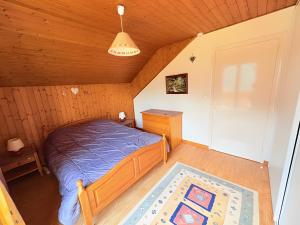 Postel nebo postele na pokoji v ubytování Chalet Loupnots 3P avec vue