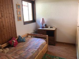 Postel nebo postele na pokoji v ubytování Chalet Loupnots 3P avec vue