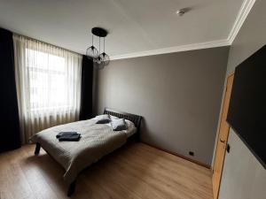 Postel nebo postele na pokoji v ubytování ApartHotel Riga