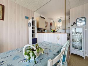 a hospital room with a bed and a kitchen at Studio Mer & Soleil-3 by Interhome in Saint-Brévin-lʼOcéan