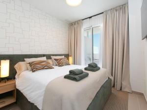 Ένα ή περισσότερα κρεβάτια σε δωμάτιο στο Apartment Bayviewhill Luxury free Spa & Padle by Interhome