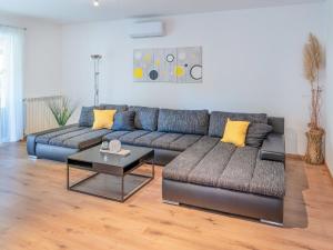 a living room with two couches and a coffee table at Holiday Home Gabi by Interhome in Brtonigla +28 photos