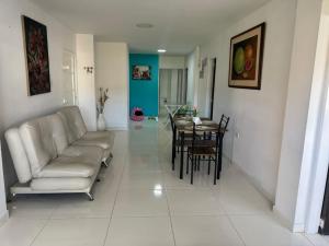 a living room with a couch and a table at Apartamento Pitalito in Pitalito