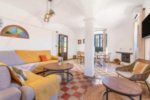 a living room with a couch and a table at Finca Las Cabrillas La Nava in La Nava